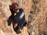 Climber wearing black and white Neon T-shirt