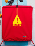 Red belay gate reading CLIP IN by Neon Climbing Accessories.