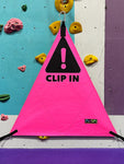 Customizable triangle belay gates for commercial gyms. CLIP IN warning printed on bright pink belay gate.